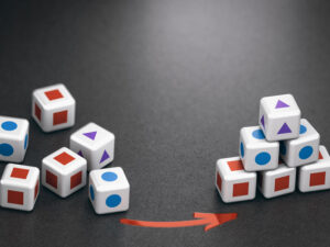 two groups of die piled and presented differently to illustrate the difference between managed Services and IT outsourcing services