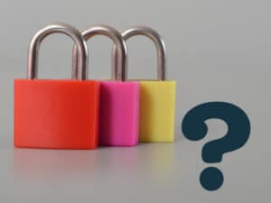 Three different colored padlocks and a question mark to illustrate choosing cybersecurity solutions in Charlotte, NC