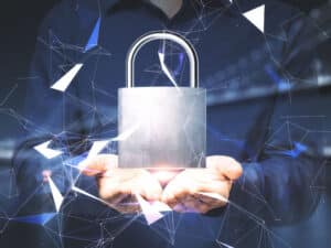 man holding a glowing padlock to illustrate stronger cybersecurity services for mid-market businesses