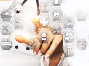 A finger pointing through glass at various healthcare and security symbols to illustrate choosing a managed service provider who knows about HIPAA compliance